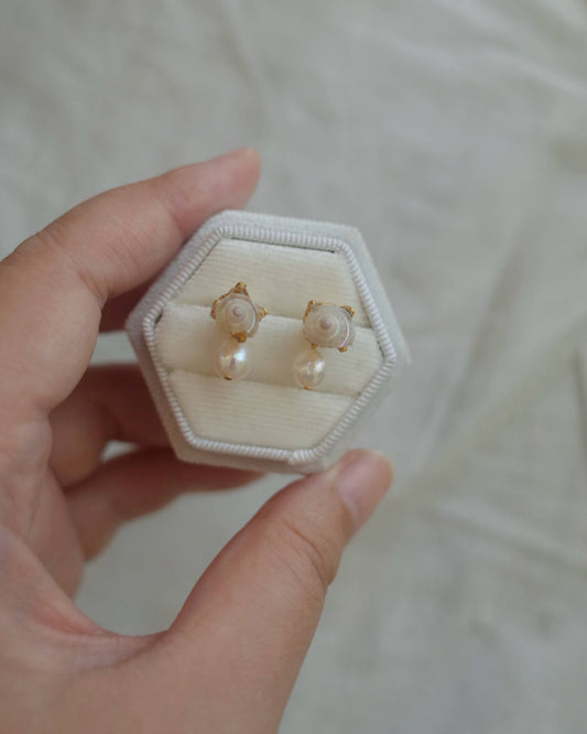 White seashell piercing