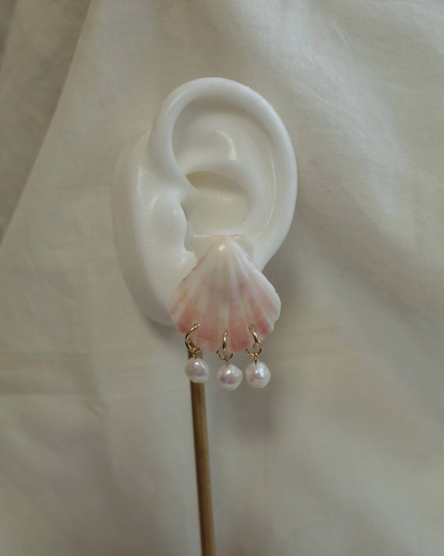 Pink seashell pierce